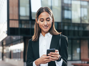 Young woman using mobile phone