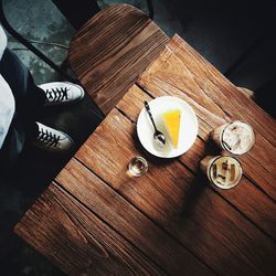 High angle view of coffee on wooden table