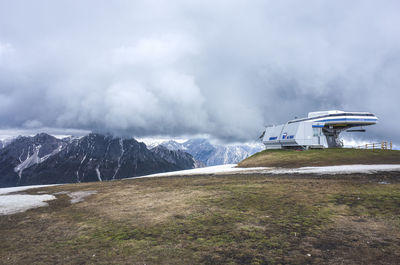 Scenic view of mountains against cloudy sky