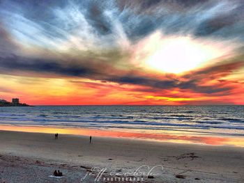 Scenic view of beach against sky during sunset