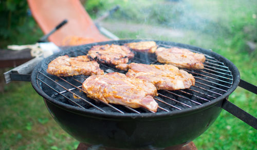 Close-up of meat on barbecue grill