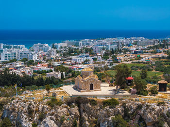 High angle view of townscape against clear blue sky