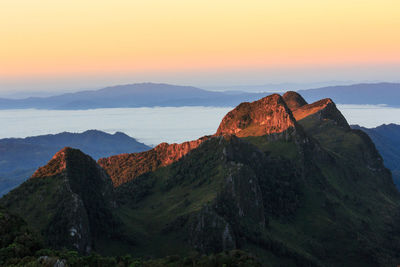 Scenic view of mountains against sky during sunset