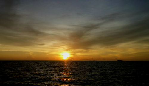 Scenic view of sea at sunset