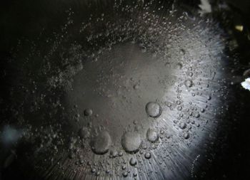 Close-up of water drops on table