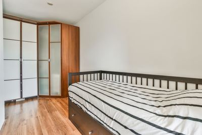 View of empty bed in bedroom