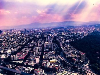 High angle view of city buildings during sunset