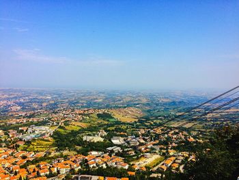 High angle view of cityscape against clear blue sky