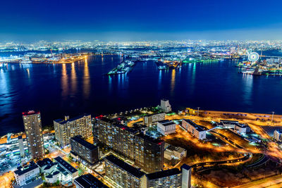 High angle view of illuminated buildings in city at night