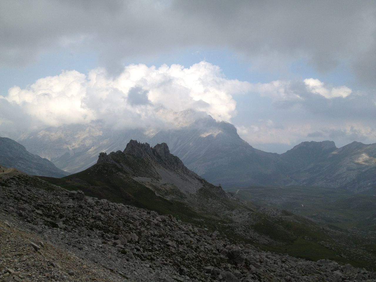 mountain, mountain range, tranquil scene, sky, tranquility, scenics, beauty in nature, cloud - sky, landscape, nature, cloudy, cloud, non-urban scene, idyllic, physical geography, remote, geology, day, outdoors, majestic