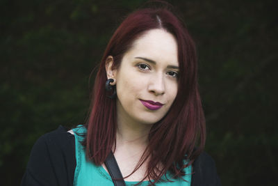 Portrait of woman against trees