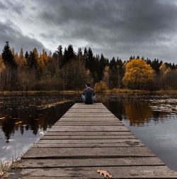 Pier over lake against sky