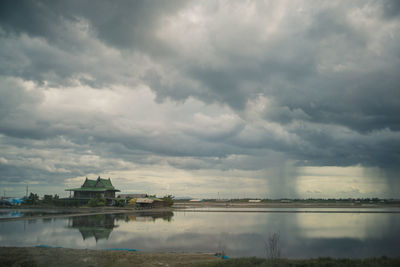 View of buildings against cloudy sky