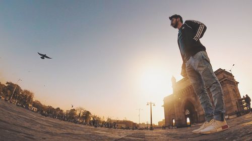 Low angle view of statue against sky during sunset