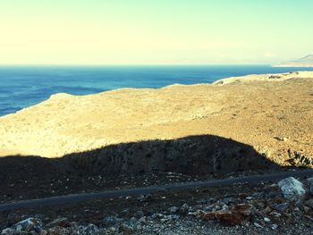 Scenic view of beach against clear sky