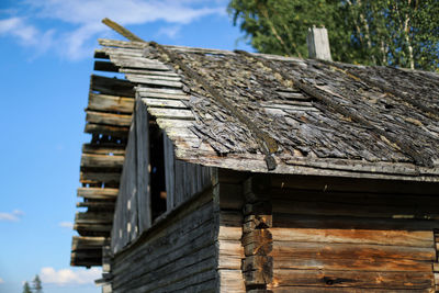 Low angle view of building roof against sky