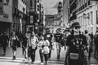 Group of people walking on city street