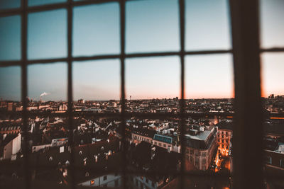 Cityscape against sky seen through window