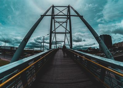 Footbridge against sky