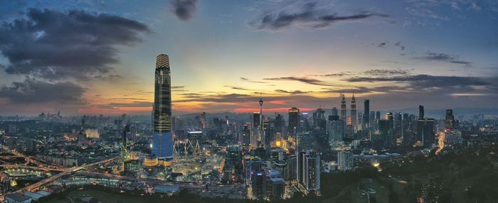 Panoramic view of buildings against sky during sunset