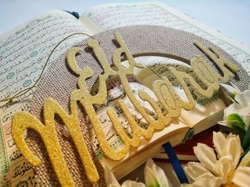 High angle view of coffee and book on table