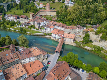 High angle view of covered bridge over river in city