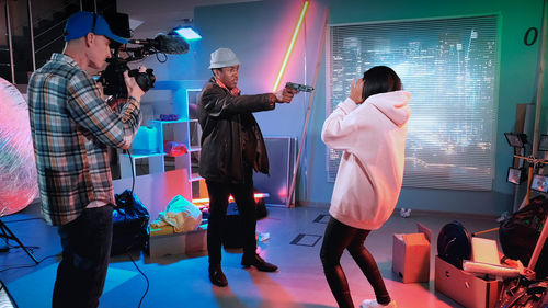 Rear view of people walking on stage