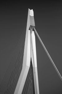 Low angle view of suspension bridge against sky