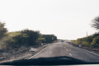 Road seen through car windshield