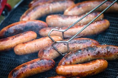 Close-up of sausages on barbecue grill