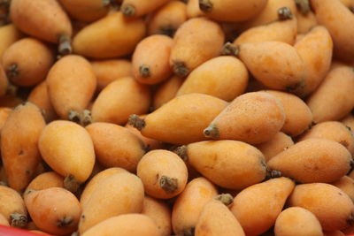 Full frame shot of loquat fruits for sale in market