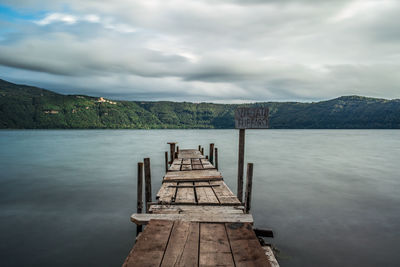 Pier over sea against sky