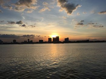 View of sea against cloudy sky during sunset