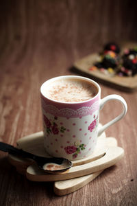 Close-up of coffee cup on table