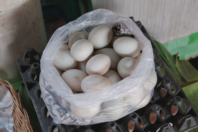 High angle view of eggs in basket at market