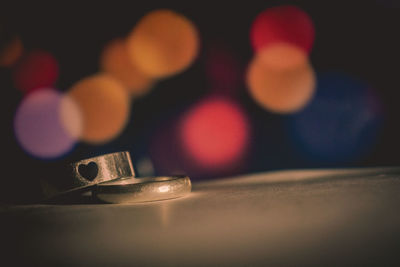 Close-up of illuminated lighting equipment on table