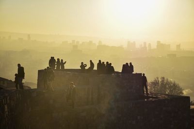 People on city during sunset