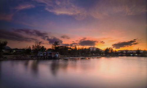 Scenic view of lake against sky during sunset