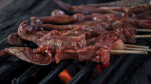 Close-up of meat on barbecue grill