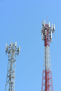 Low angle view of communications tower against sky