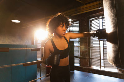 Young woman exercising in gym