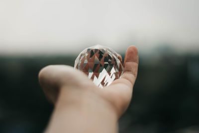 Close-up of hand holding crystal