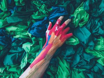 Close-up of painted hand over textile