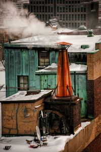 Smoke emitting from chimney during winter