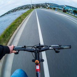 Man riding bicycle on road