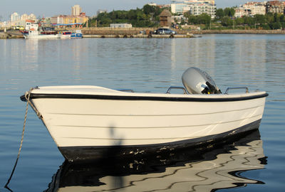 Sailboats moored on sea