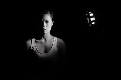 Portrait of woman in dark