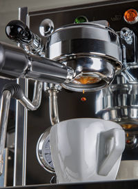 Close-up of coffee cups in kitchen