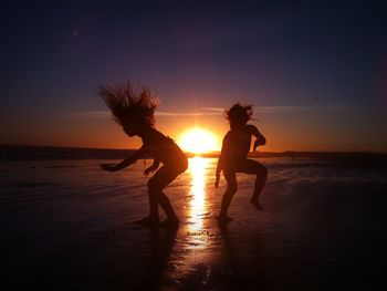 Girls dancing at sunset
