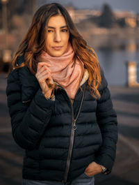 Portrait of young woman standing outdoors